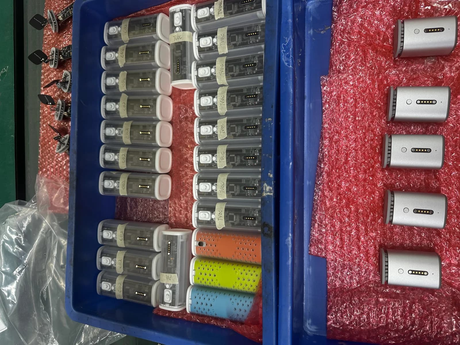 Airo prototype Pods and components arranged in trays on a workbench