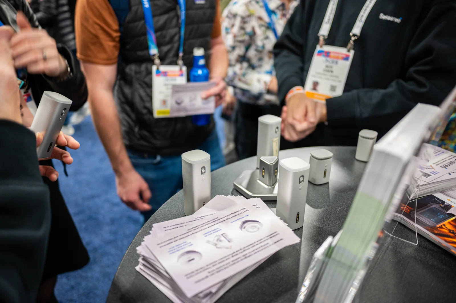 Visitors examining Airo prototypes at an exhibition display
